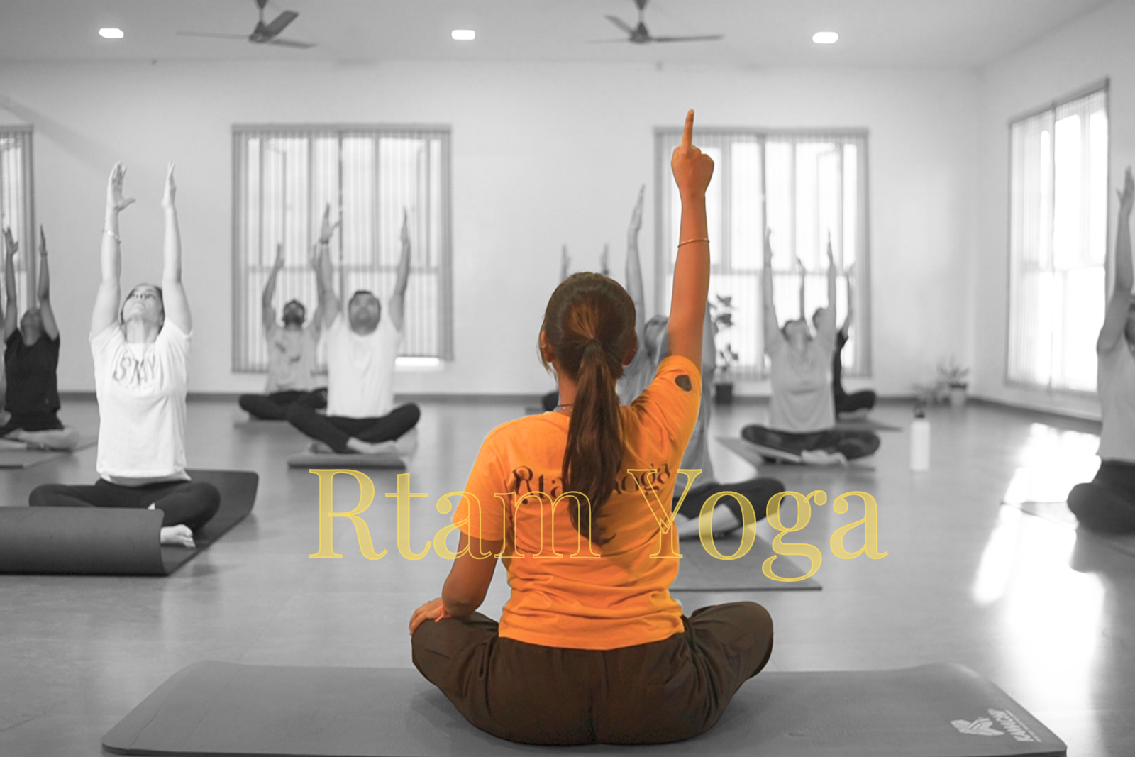 Instructor teaching Hatha yoga class at Rtam Yoga